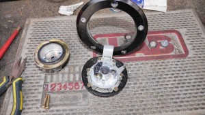 Motorcycle gas cap lock removed from gas tank